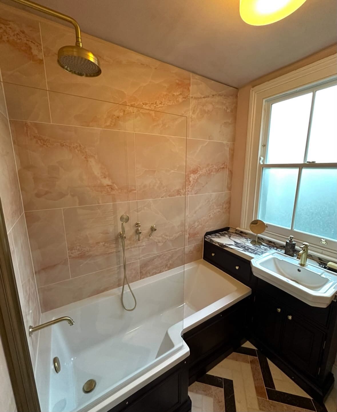 ALR Bathrooms — luxury rose marble installation with brass shower